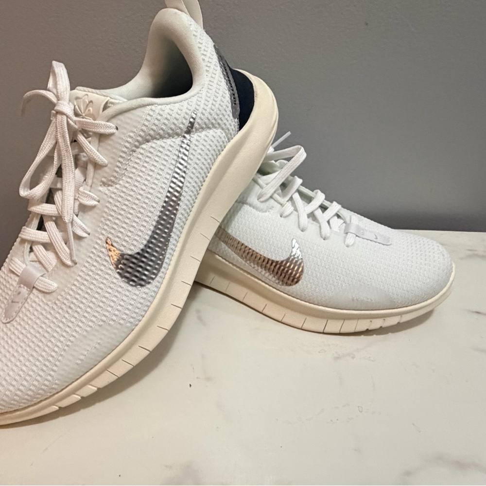 Nike Flex Experience 12 white lace up sneaker with silver swoosh.